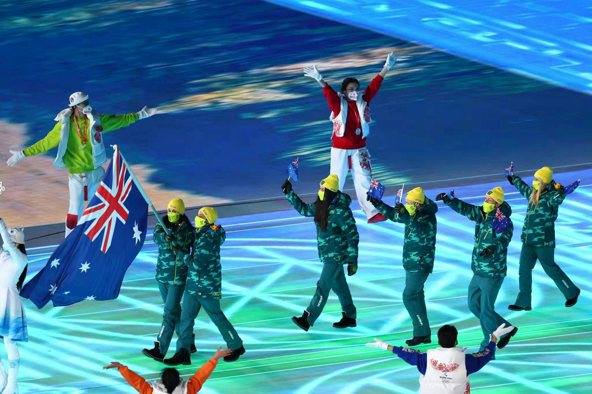 Serving as a standard-bearer to welcome athletes from around the world at the opening ceremony.